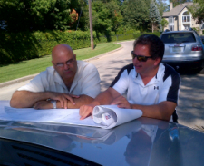 Ron and John of Richpark Homes pouring over blueprints